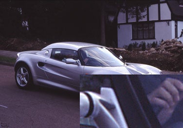 Sample scan of a silver sports car produced by the Canon CanoScan 8000F, with an inset showing a close-up of the scan quality.