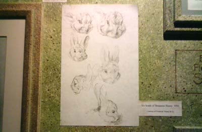 The image appears to be unrelated to the palmOne Zire 72 - PDA and looks like a series of pencil sketches of rabbits on a piece of paper, mounted on a wall.