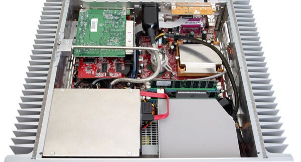 Internal components and layout of the Hush E2-MCE Silent Media Center PC, showing the motherboard, expansion cards, and cooling system within a metal case with large heat sinks.