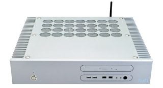 Front view of a Hush E2-MCE Silent Media Center PC showing the case design with circular ventilation holes on the top and front ports including USB and audio jacks.