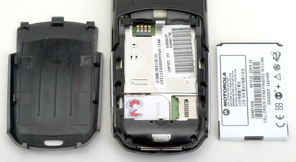 Disassembled Motorola E1000 mobile phone showing the inside components including the battery and SIM card slot.