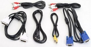Assorted cables and connectors likely included with the Dell W2600 26-inch LCD TV, featuring various video and audio input options.