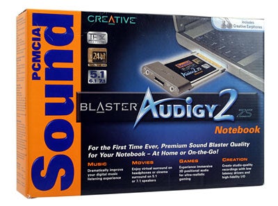 Product packaging for Creative Sound Blaster Audigy 2 ZS Notebook PCMCIA sound card, highlighting features such as 24-bit advanced HD audio, 5.1 surround sound, and included earphones. The box is mainly orange and blue with text and images showcasing the product's capabilities for music, movies, games, and creation.