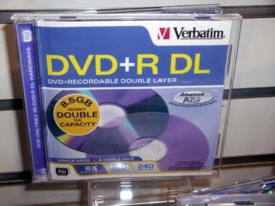 A Verbatim DVD+R DL (Double Layer) disc package on a shelf, indicating 8.5GB storage capacity, which may be used with the NEC ND-3520A DVD Writer.