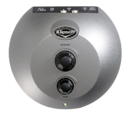 Close-up view of Klipsch Promedia GMX A-2.1 speaker set control pod with master and sub volume knobs, auxiliary inputs, and the Klipsch logo.