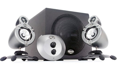 Klipsch Promedia GMX A-2.1 speaker set consisting of two satellite speakers and a subwoofer, with a control pod in the center, against a white background.