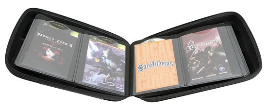 Open Slappa Optical Disc Storage case displaying various CDs and video game discs with clear plastic sleeves for organization and protection.