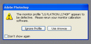 Error message in Adobe Photoshop indicating a defective monitor profile for the LG Flatron L1740P monitor, suggesting rerunning monitor calibration software.