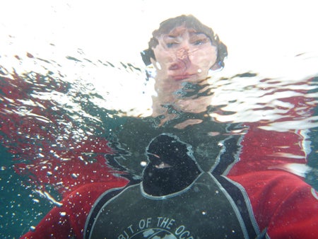 Photo taken underwater with a Sony VAIO VGN-FS115B - Sonoma Notebook, showing a person's distorted reflection on the water surface.
