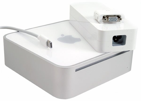 Apple Mac mini with power cable and various ports visible against a white background.