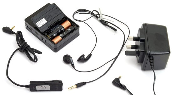 Sony XDR-M1 Pocket DAB Tuner with accessories including earphones, batteries, and power adapter displayed on a white background.