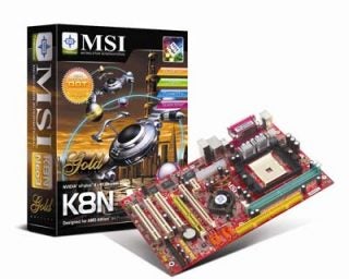 Product review image featuring the MSI K8N Neo3-FSR motherboard alongside its retail packaging box with vivid graphics emphasizing its Gold Edition status.