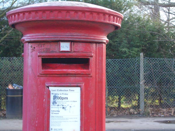 Photo of a red British postbox with collection times, taken with a Casio Exilim Zoom EX-Z50 Digital Camera to demonstrate image quality.