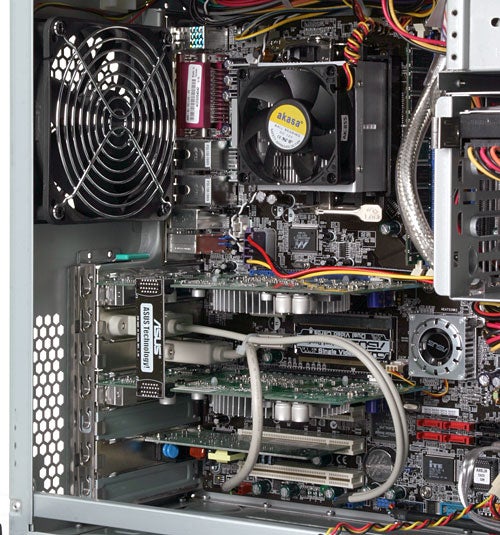 Interior view of Mesh Matrix Fireblade TRX - SLi PC showing the arrangement of components such as the motherboard, CPUs, cooling fans, GPU, and cabling.