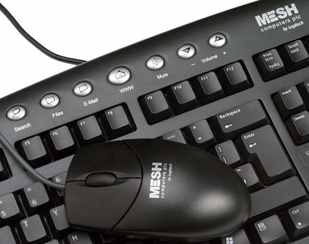 Close-up of a black keyboard and mouse with the MESH logo, possibly accessories of the Mesh Matrix Fireblade TRX - SLi PC.