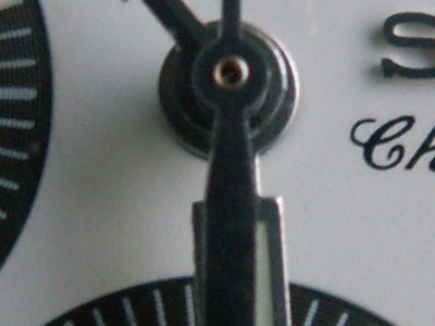 Close-up of a precision instrument dial taken with the Konica Minolta DiMAGE Z5 camera, highlighting the camera's macro photography capability.