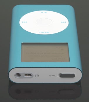 Blue iPod mini - 2nd Gen 6GB music player reflecting on a glossy surface, showcasing its screen and click wheel.