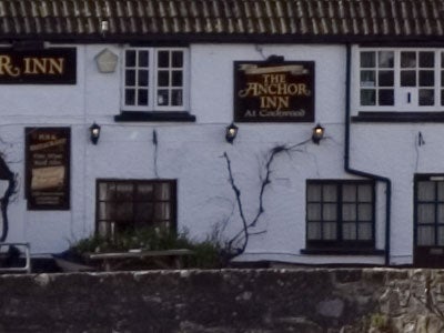 Photograph taken with the Pentax *ist DS - Digital SLR featuring the exterior of The Anchor Inn with details such as signage and exterior lighting visible.