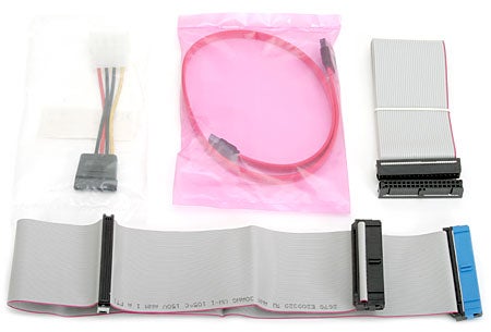 Product review components of ECS 915P-A (1.2A) motherboard including cables and connectors displayed on a white background.