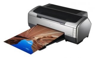 Epson Stylus Photo R1800 inkjet printer with a high-quality color printout of a canyon landscape emerging from the device, illustrating print quality and colour reproduction.