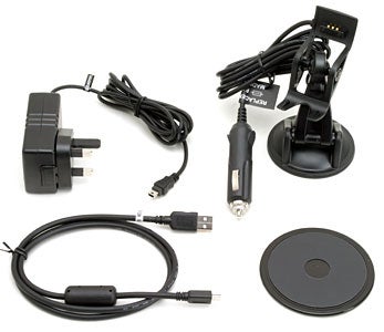 Assorted accessories for the Garmin StreetPilot c320 GPS Navigation System, including a car adapter, USB cable, mount, and power adapters.