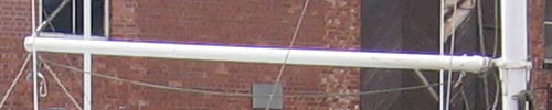 Photo demonstrating the image quality of the Canon PowerShot A510 digital camera, featuring a blurred shot of a sailboat's rigging against a brick building background.