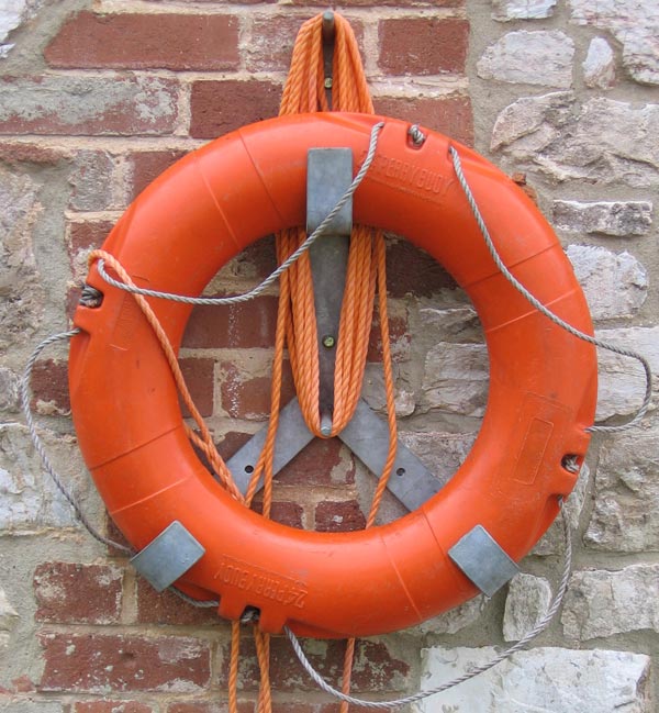 Orange lifebuoy hanging on a brick wall, captured using the Canon PowerShot A510 Digital Camera to demonstrate its image quality.A comparison of four photos showing the impact of different ISO settings on image quality when taken with the Canon PowerShot A510 Digital Camera, with ISO levels of 50, 100, 200, and 400 labeled respectively.