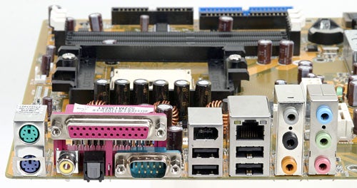 Close-up view of the Asus K8N4-E Deluxe motherboard showing the variety of ports, capacitors, and the CPU socket.