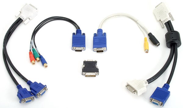 Various cables and adapters for the Matrox Parhelia APVe graphics card, including DVI, VGA, S-Video, and RCA connectors, on a white background.