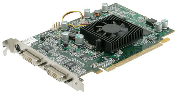 Close-up of the Matrox Parhelia APVe graphics card showing its dual DVI connectors, PCI interface, cooling fan, capacitors, and other electronic components.