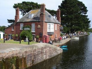 Scenic view of a canal and building captured with a digital camera.