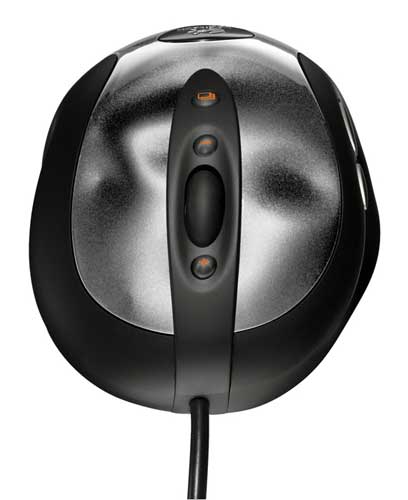 Close-up view of the Logitech MX518 Gaming Mouse showing the top with scroll wheel and buttons against a black background.