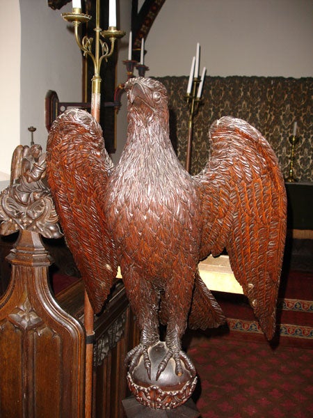 Bronze eagle lectern in a church interior.