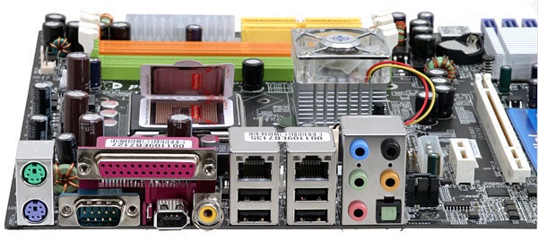 Close-up view of MSI P4N Diamond Pentium SLI Motherboard showing RAM slots, CPU socket, heat sinks, rear I/O ports, and expansion slots.