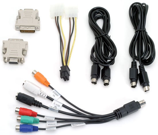 A variety of cables and adapters associated with the XFX GeForce 7800 GTX Graphics Card, including power cables, VGA adapters, and AV connectors.