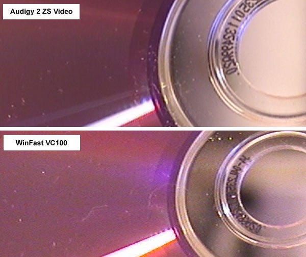 Close-up comparison of two optical discs with reflections, labeled 'Audigy 2 ZS Video' and 'WinFast VC100,' possibly highlighting differences in disc quality or recording results.
