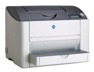 Konica Minolta Magicolor 2450 printer, a compact desktop color laser printer with a front paper tray and a simple control panel.