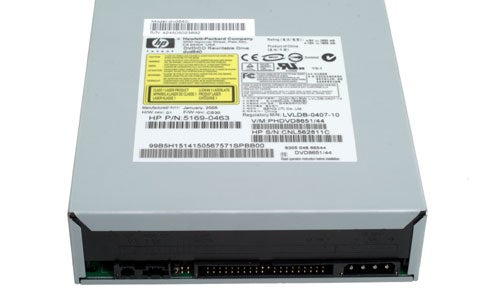 Close-up view of an HP dvd640i DVD Writer showing the product label with details and regulatory information.