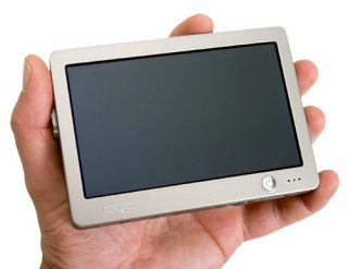 Hand holding the OQO model 01 Pocket Size PC displaying its compact size and screen
