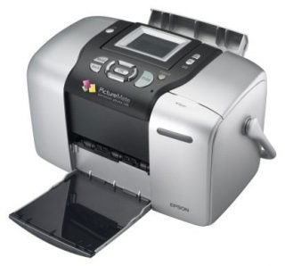 Epson PictureMate 500 photo printer with an open output tray displaying the control panel and color preview screen.