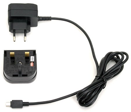 Charger for the Garmin Forerunner 301, including a power adapter with European plug and a charging cradle with a USB connector cable.