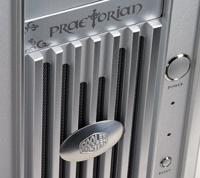 Close-up of the front panel of the Cooler Master Praetorian 731 PC Case showing detail of the metallic finish, branding, and power button.