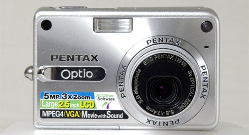 Pentax Optio S5z digital camera displayed against a neutral background, highlighting its silver body, lens, and specific features such as 5MP resolution, 3x Zoom, and a large 2.5 inch LCD.