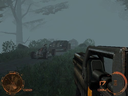 In-game screenshot from the PC FPS game Chrome Specforce showing a first-person view with a weapon aimed at an enemy character in a foggy, forest-like environment with a vehicle in the background.