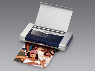 Canon Pixma iP90 Inkjet Printer with an output photo of a woman wearing a hat, showcasing print quality.