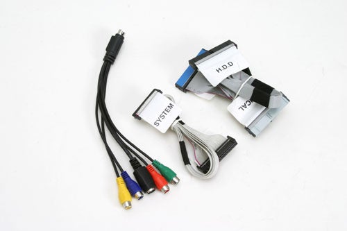Assorted cables and connectors associated with the AOpen XC Cube EZ482 SFF Barebone system, including audio and video cables, and power and data ribbon cables.