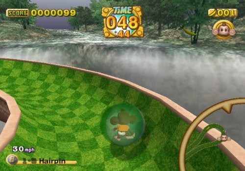 Screenshot of gameplay from Super Monkey Ball Deluxe showing a monkey character inside a transparent ball on a curved level path with a misty background, in-game score, time, and banana count displays, and a speedometer indicating 30 mph.