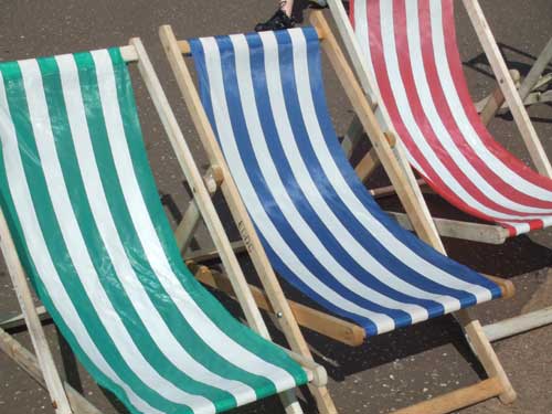Photo taken with the Fujifilm Z1 capturing the vibrant stripes of blue and red on deck chairs.