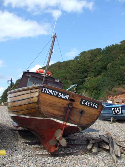 Photograph taken with a Fujifilm Z1 camera featuring a weathered boat named 