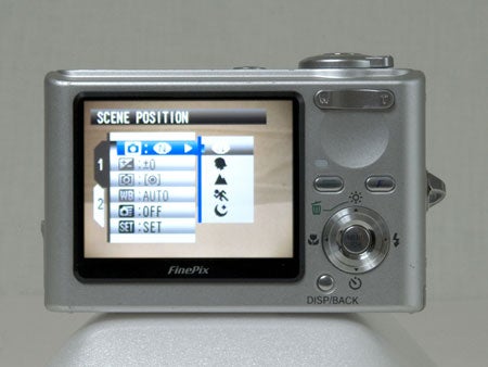 Fujifilm FinePix F10 digital camera displaying its scene position menu on the LCD screen.